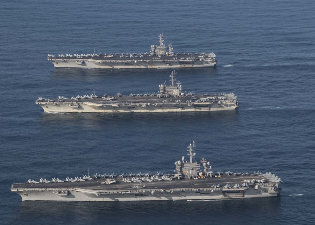 171112-N-LB724-346 WESTERN PACIFIC (Nov. 12, 2017) The USS Ronald Reagan (CVN 76), USS Theodore Roosevelt (CVN 71) and USS Nimitz (CVN 68) Strike Groups are underway, and conducting operations, in international waters as part of a three-carrier strike force exercise. The U.S. Navy has patrolled the Indo-Asia Pacific region routinely for more than 70 years promoting regional security, stability and prosperity. (U.S. Navy photo by Lt. j.g. James Griffin)