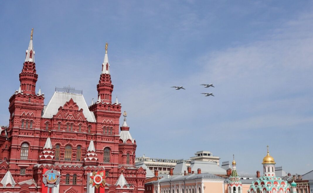 Moscow, Russia, May 2022: The flight in the sky of three IL-76MD heavy long-range military aircrafts in a blue sky. The main rehearsal of military par