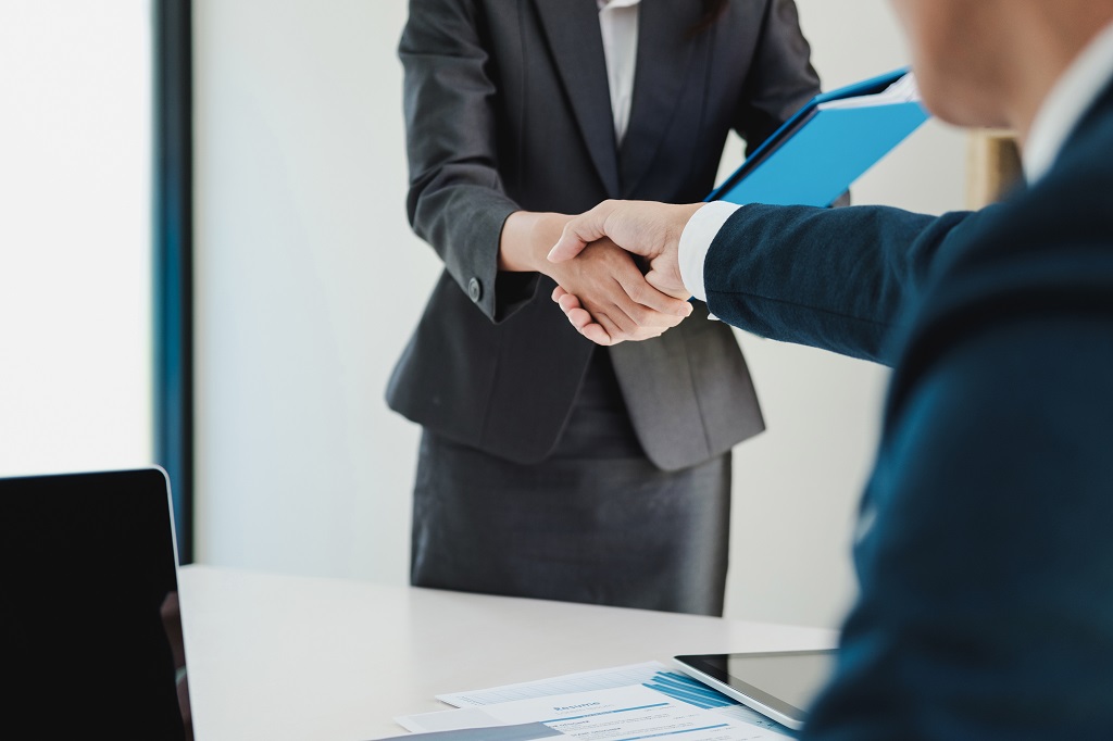 Job applicant having interview. Handshake while job interviewing