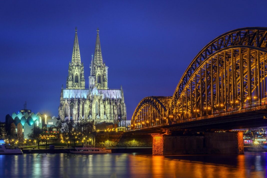 Cologne Cathedral (Dom) and Hohenzollern Bridge at blue hour