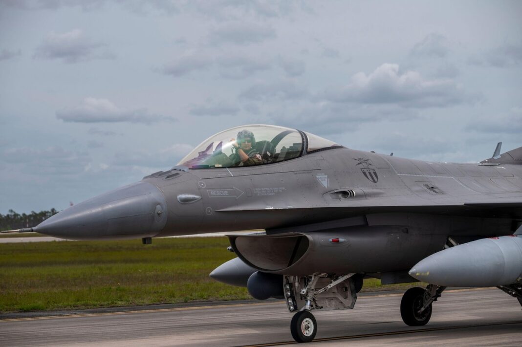 An F-16 Fighting Falcon pilot with the 121st Fighter Squadron, Andrews Air Force Base, Maryland, poses for a photo during Weapons System Evaluation Program-East 23.07 at Tyndall AFB, April 11, 2023. WSEPs are formal, two-week evaluation exercises designed