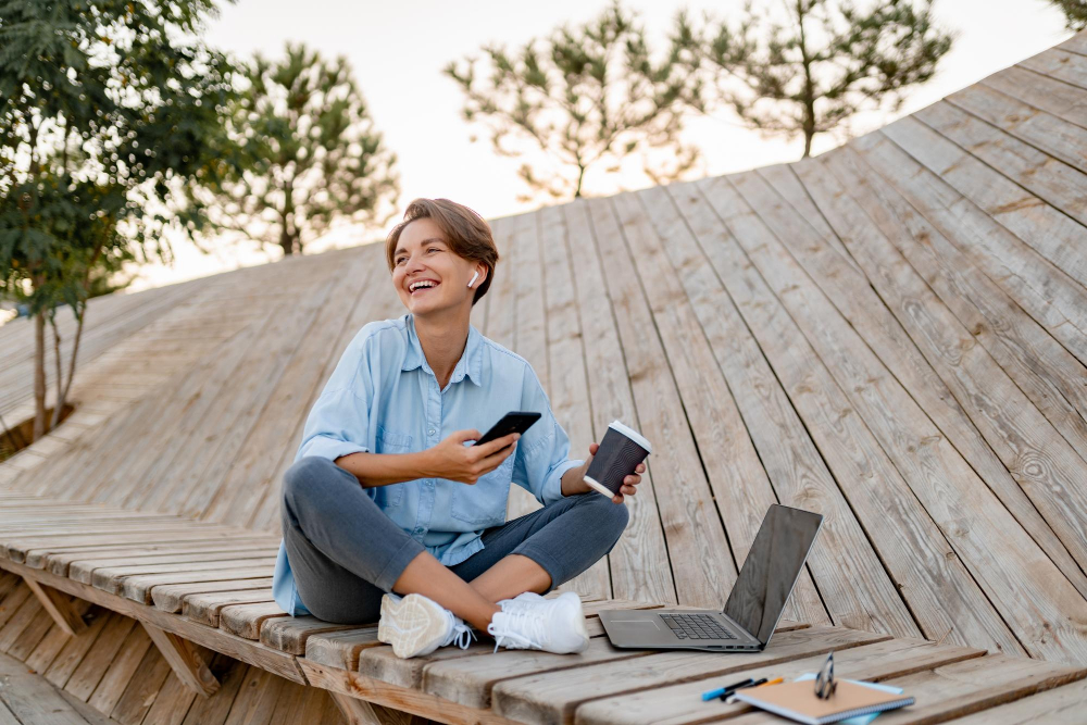 young-pretty-woman-working-laptop-modern-park-street